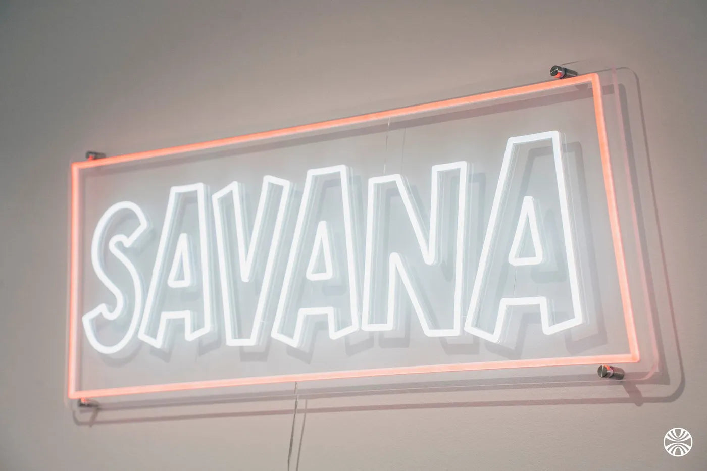 The SAVANA neon sign at the office