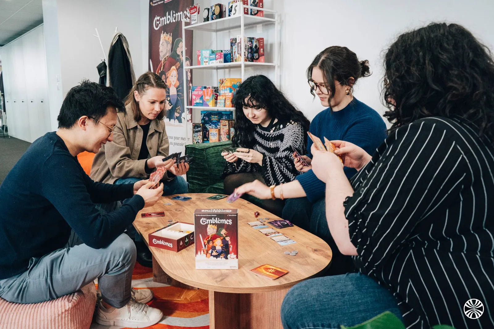 A game of Emblems with colleagues around the coffee table